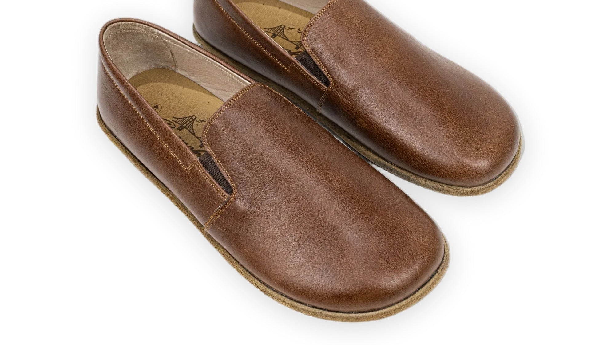 Brown full-grain leather barefoot shoes with a wide toe box by Bespoky, the foot-shaped fit an accurate size chart measurement is made for