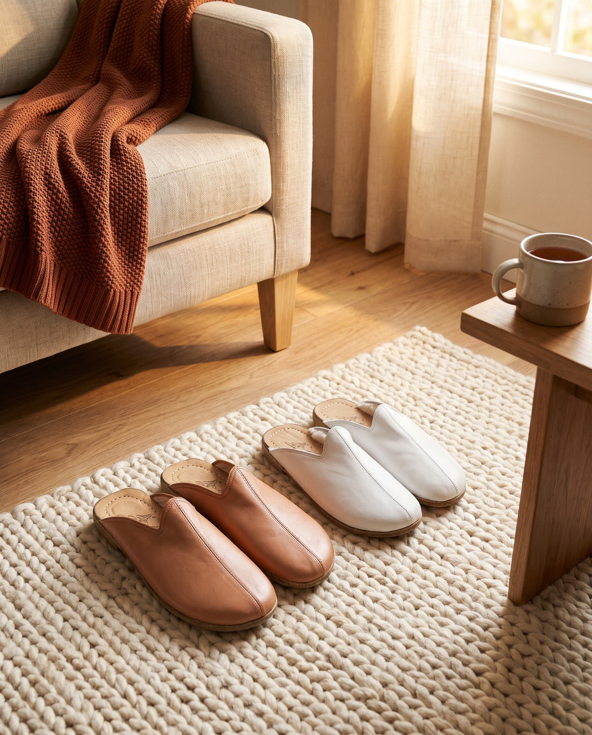 Tan leather barefoot slippers on a rug in a sunlit living room | Bespokyshoes